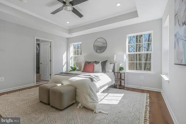 a bedroom with a large bed and a window