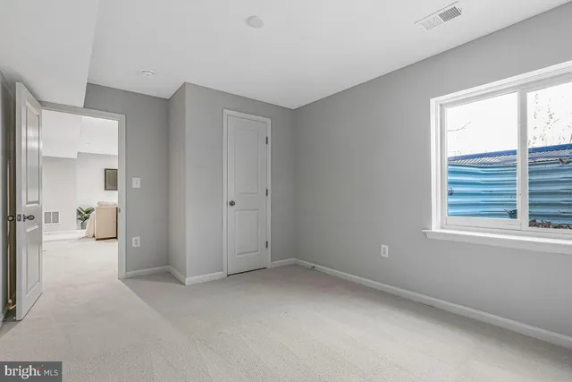 a view of a room with a window and a bathroom