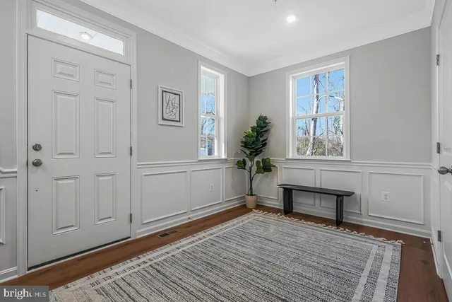 a view of livingroom with furniture window and front door