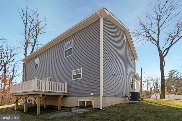 a view of a house with wooden deck