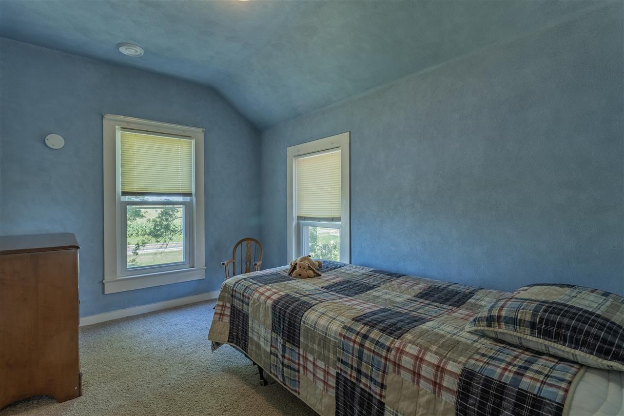 12918 Edwardsville Road Winnebago, IL 61088 - Photo 26 of 33 a bedroom with a bed and a window