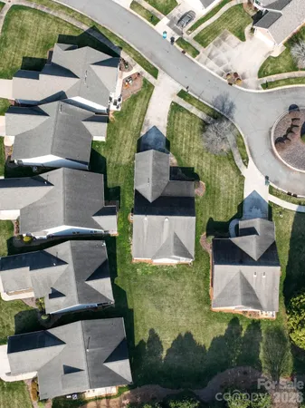 an aerial view of residential house with outdoor space and swimming pool