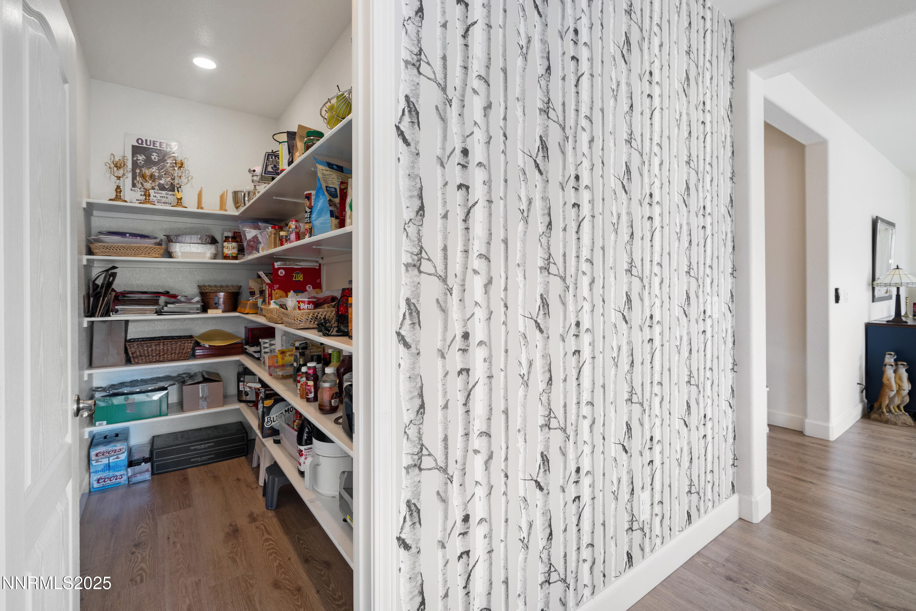 10260 Rollins Drive Reno, NV 89521 - Photo 13 of 44 a view of a hallway with wooden floor and closet