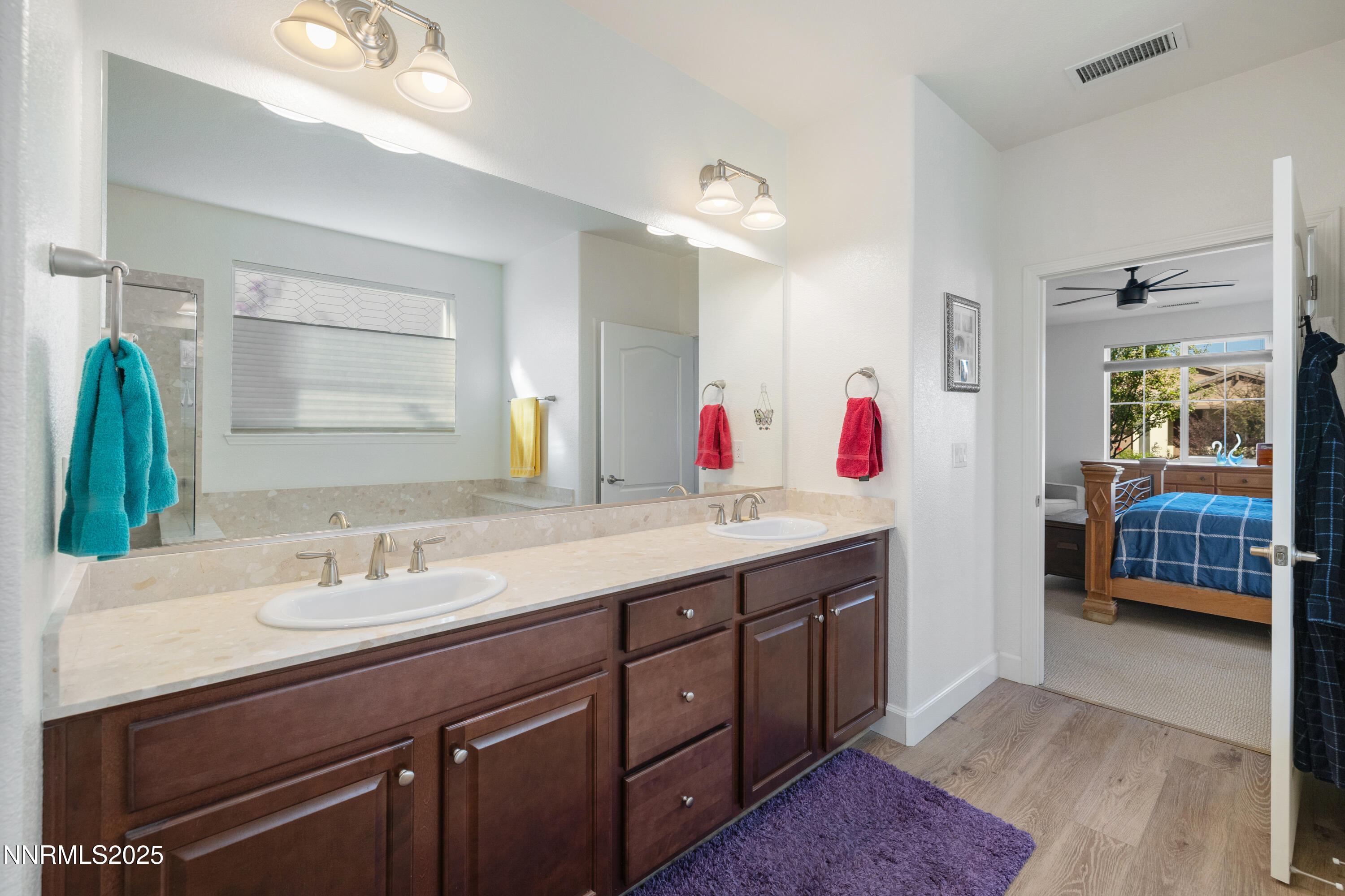 10260 Rollins Drive Reno, NV 89521 - Photo 19 of 44 a bathroom with a sink vanity and a mirror
