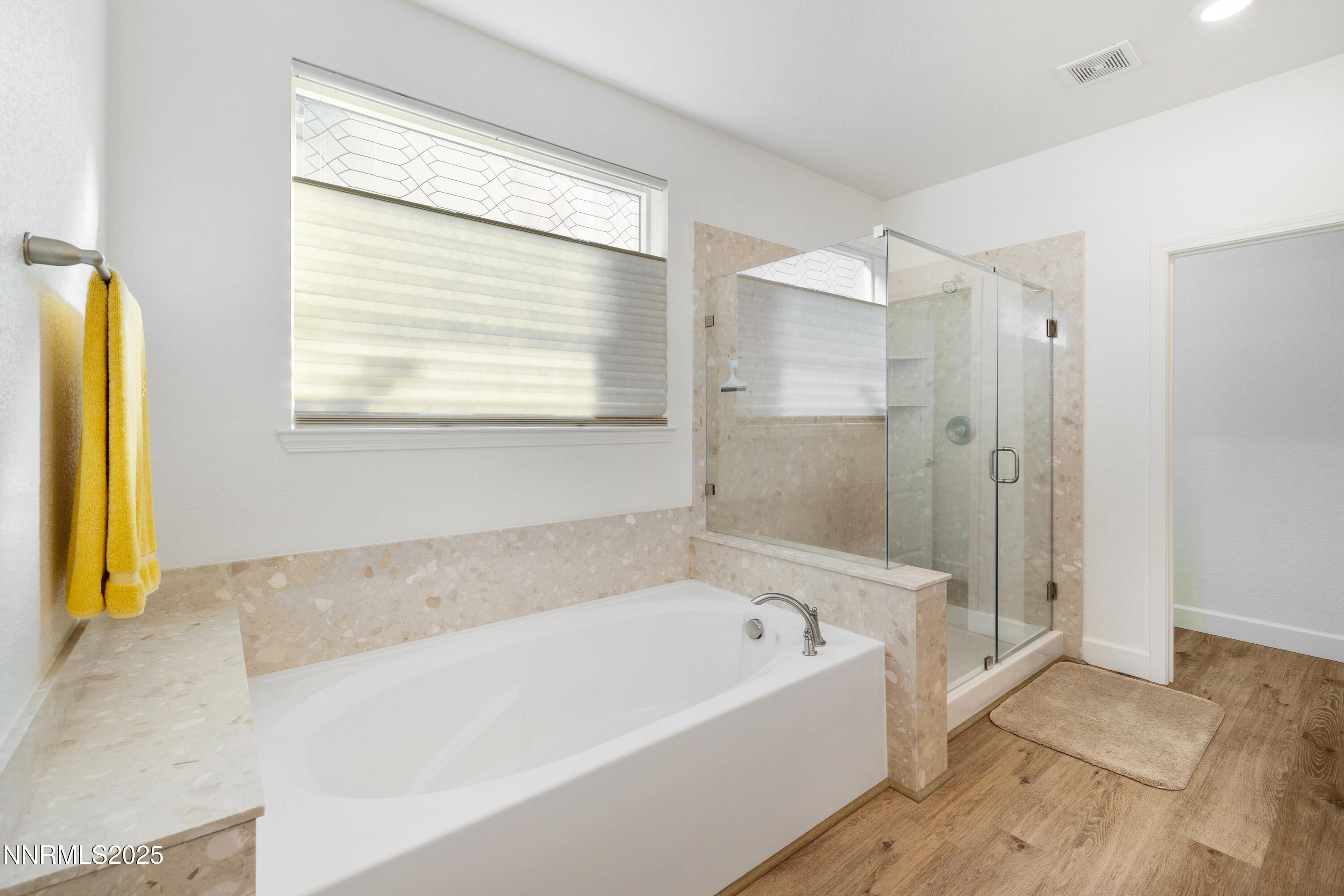 10260 Rollins Drive Reno, NV 89521 - Photo 21 of 44 a bathroom with a bathtub and a shower