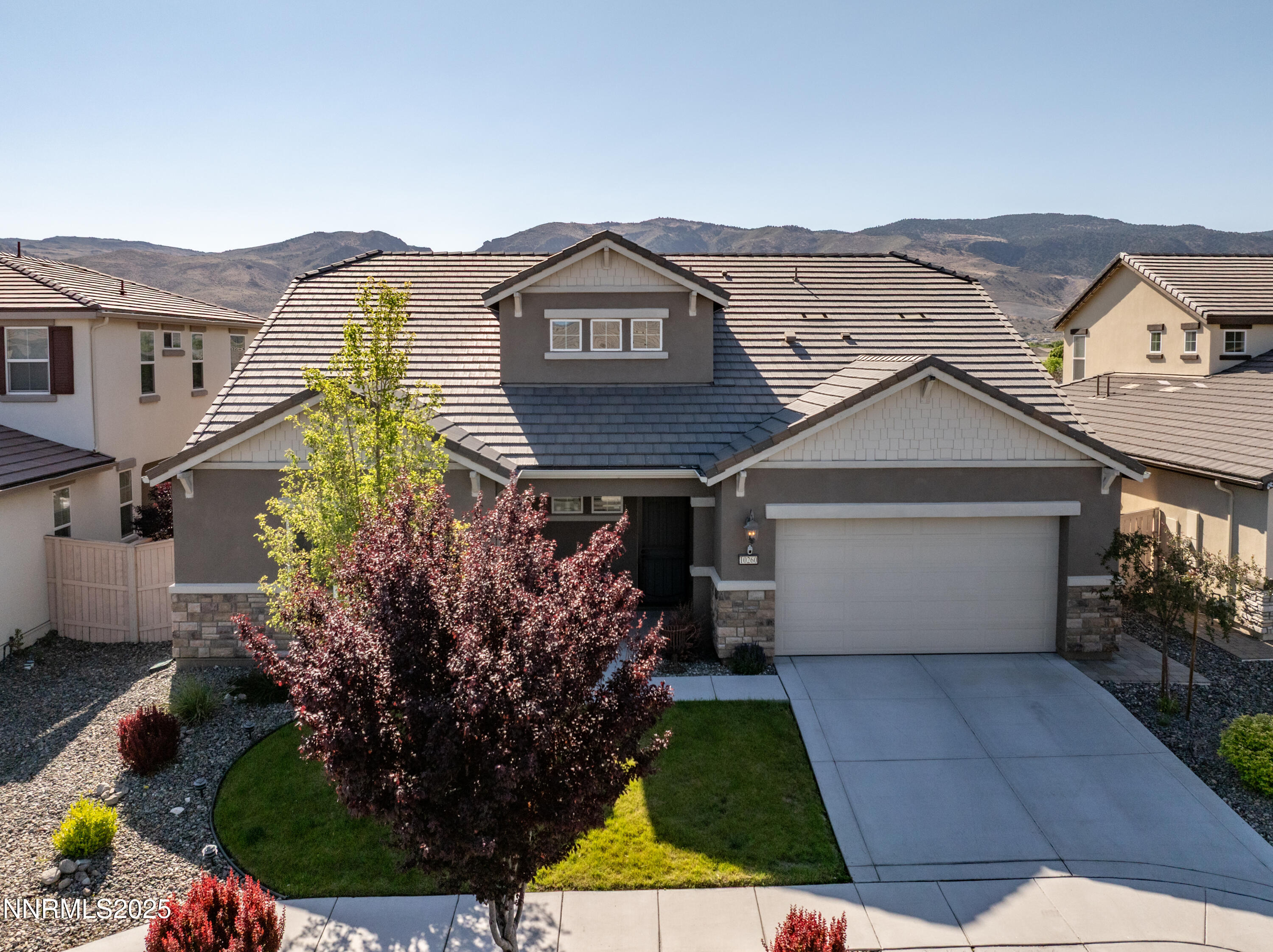 10260 Rollins Drive Reno, NV 89521 - Photo 37 of 44 a view of a white house next to a yard