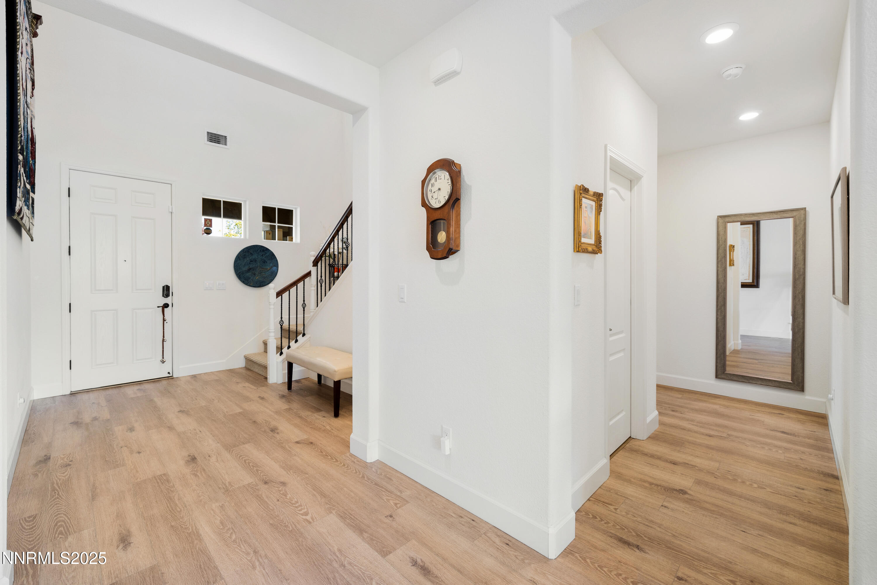 10260 Rollins Drive Reno, NV 89521 - Photo 7 of 44 a view of a room with wooden floor and white walls
