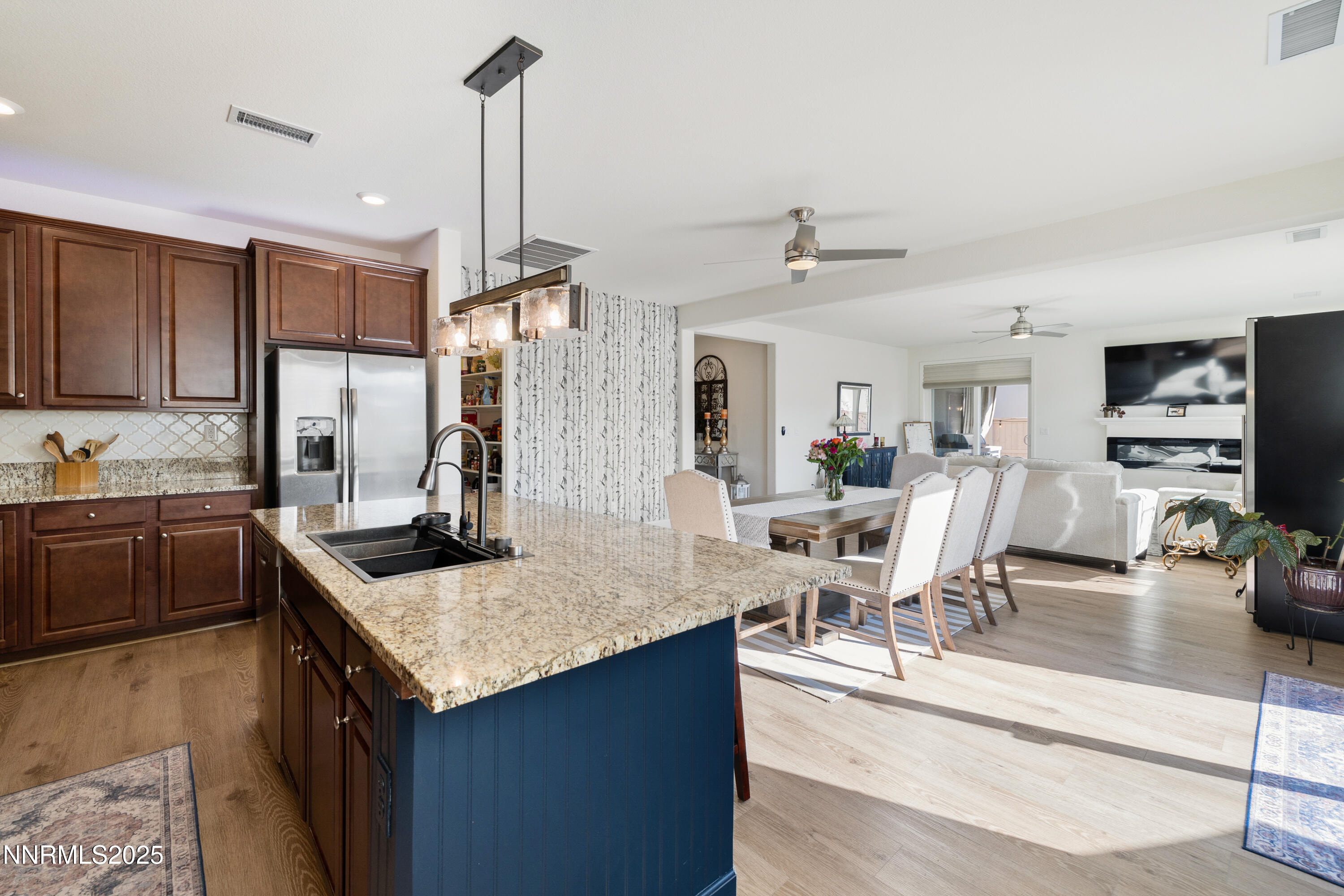 10260 Rollins Drive Reno, NV 89521 - Photo 9 of 44 a kitchen with granite countertop a sink counter top space and stainless steel appliances