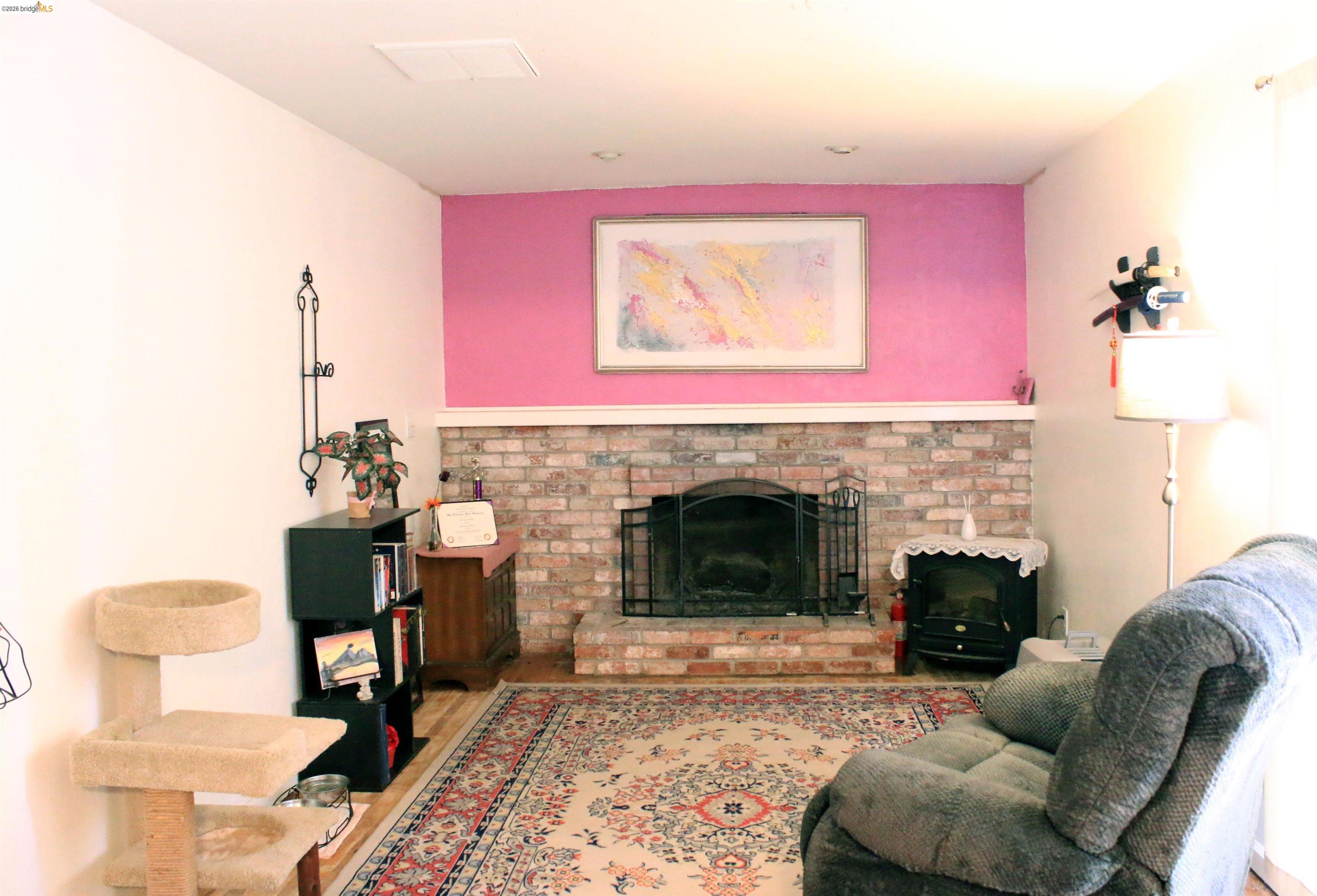 190 Tahoe Drive Rio Vista, CA 94571 - Photo 11 of 44 Living room featuring a fireplace and wood finished floors