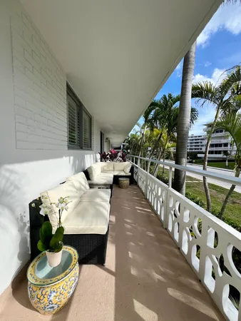 a view of a chairs and table in a backyard
