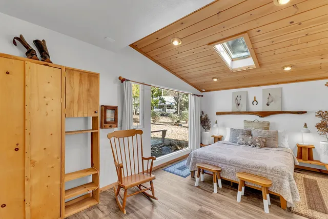 a living room with furniture and a clock