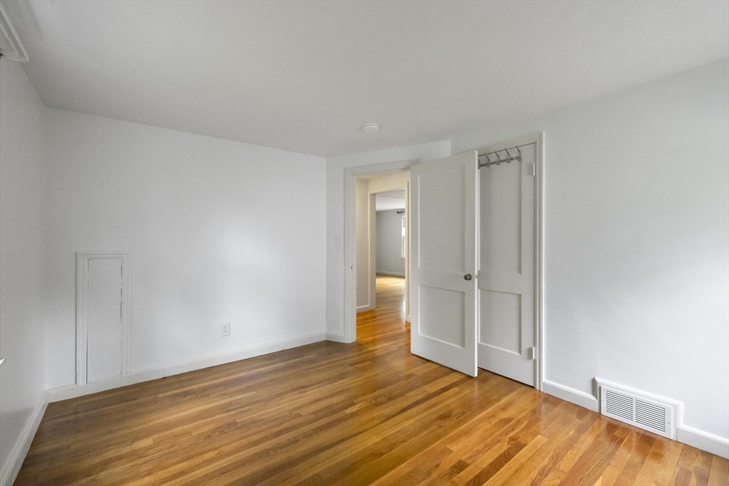 1652 Parker Street Springfield, MA 01128 - Photo 15 of 22 a view of an empty room and wooden floor