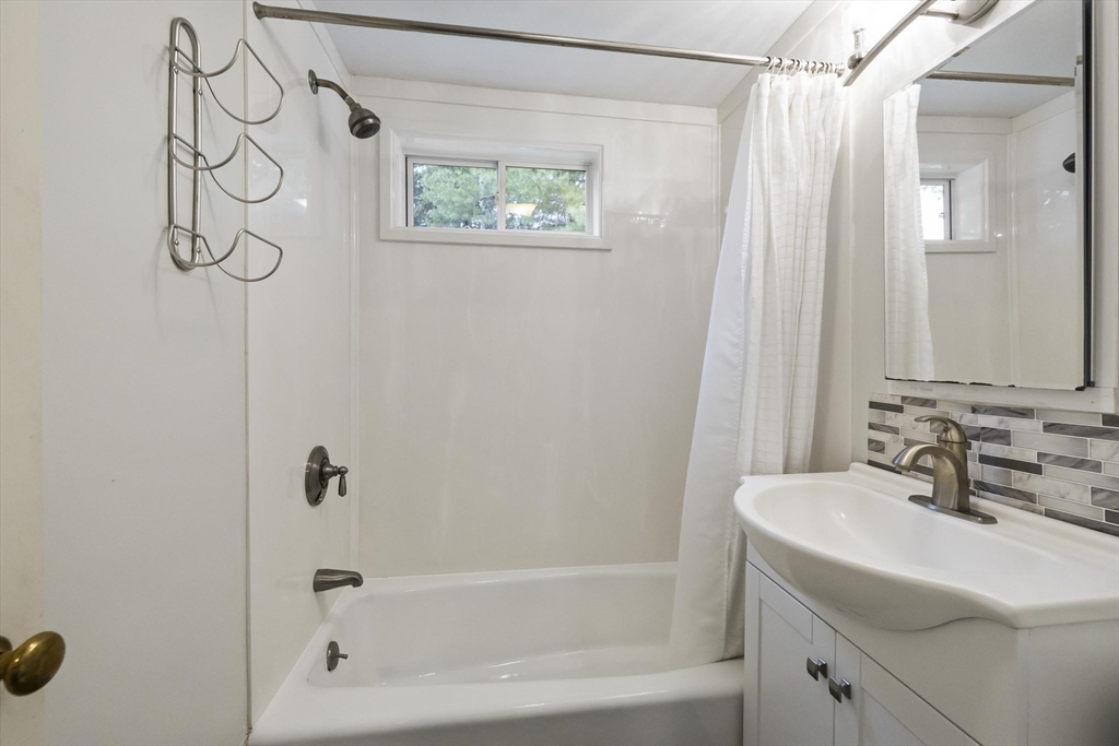 1652 Parker Street Springfield, MA 01128 - Photo 17 of 22 a bathroom with a sink a toilet and shower