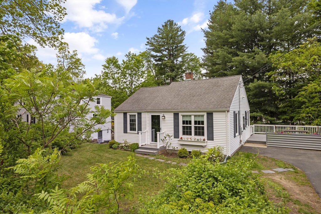 1652 Parker Street Springfield, MA 01128 - Photo 2 of 22 a front view of house with yard and trees around