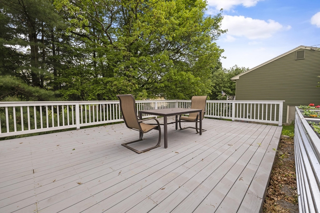 1652 Parker Street Springfield, MA 01128 - Photo 5 of 22 a view of a wooden deck with a bench