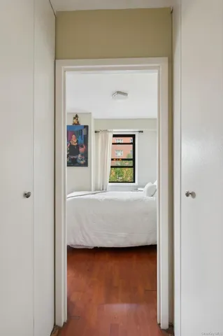 a living room with a bed and a window