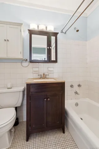 a bathroom with a sink a toilet and a bathtub