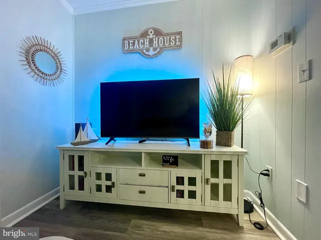 a bedroom with a bed and a television