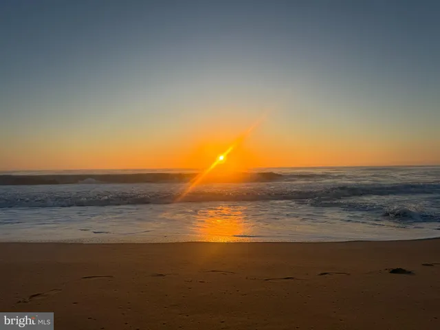a view of a swimming pool with a yard
