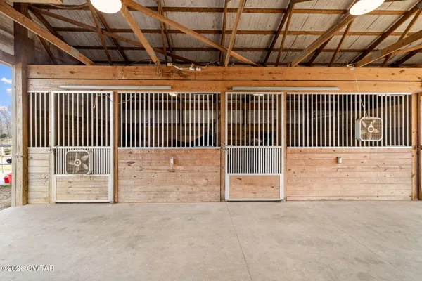 a bedroom with a bed and a table with rug
