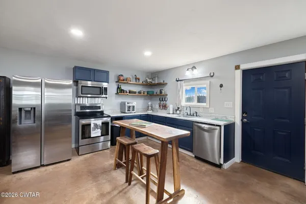 a view of a pathway with a wrought fence