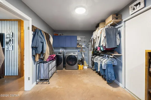 a view of a house with backyard porch and sitting area