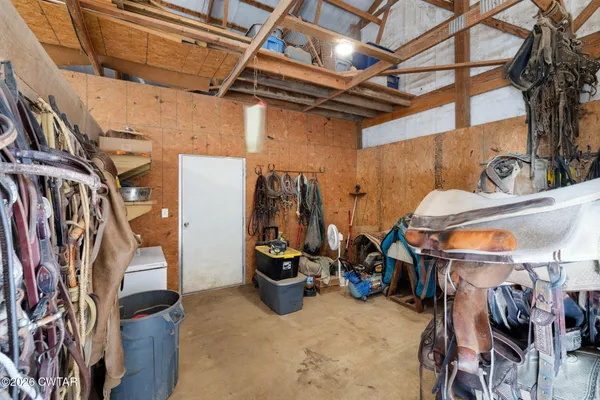 a view of swimming pool with outdoor seating and covered with palm trees