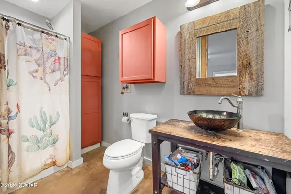 a view of a house with a wooden deck