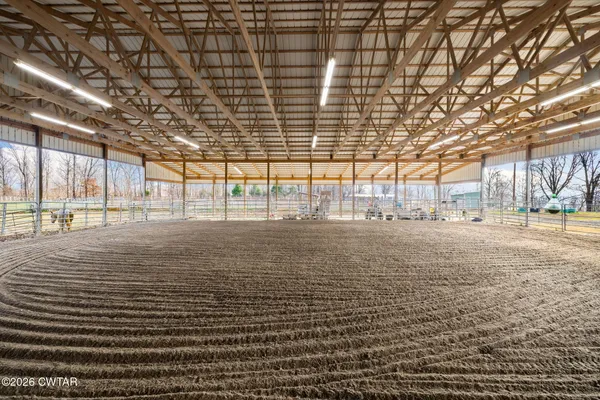 a living room with furniture and a ceiling fan