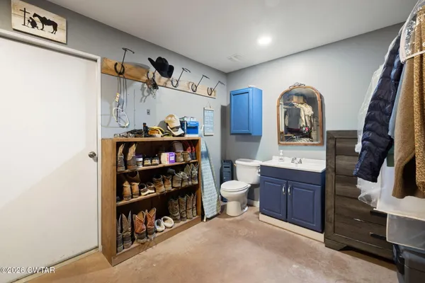 a view of a kitchen with a sink and cabinets