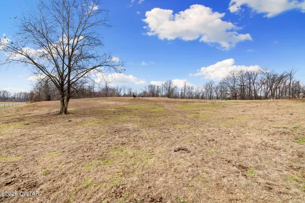 an aerial view of residential building with parking space