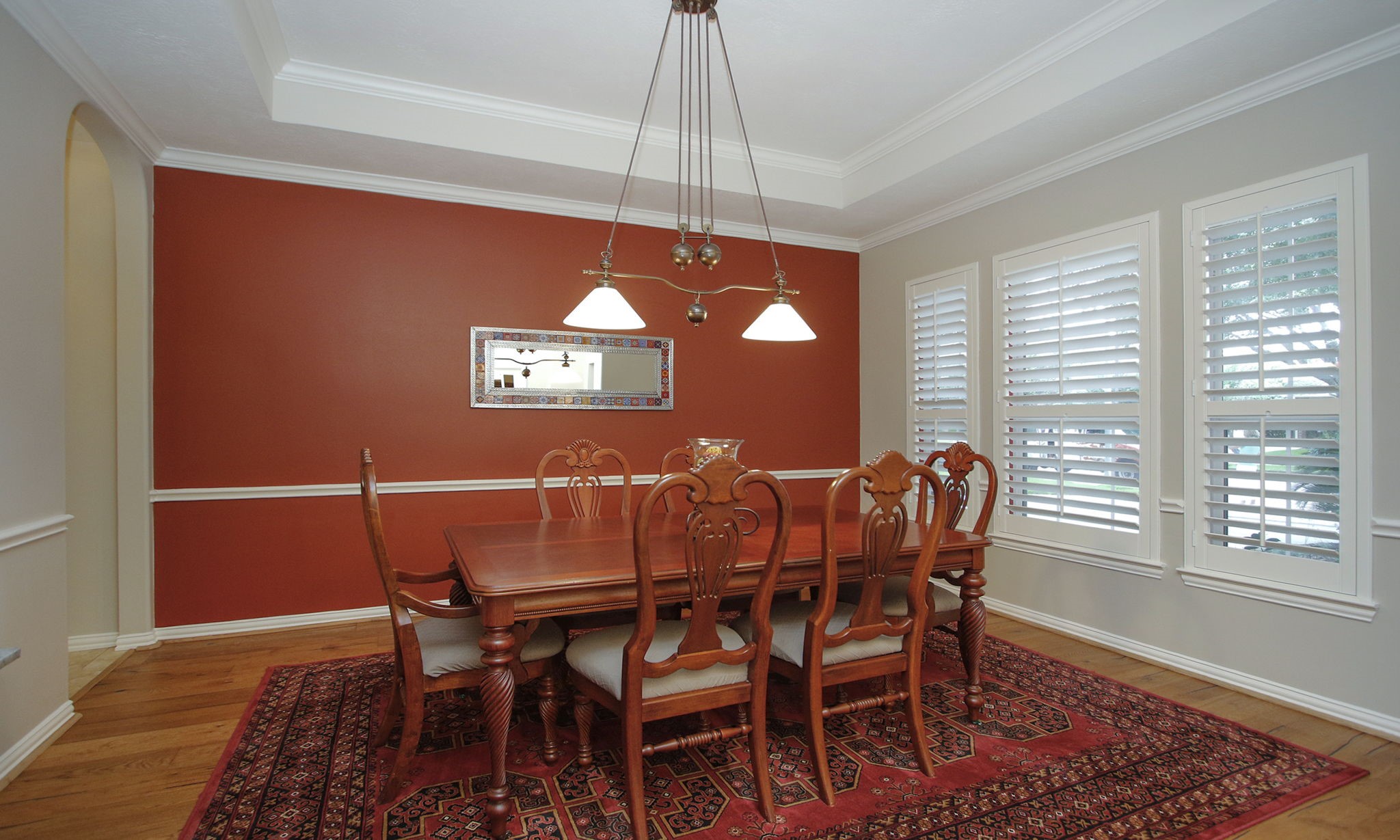 20110 Stormy Pine Lane Spring, TX 77379 - Photo 7 of 44 An elegant formal dining room with tray ceiling, chair rail and plantation shutters provides the perfect setting for intimate dinners or large gatherings alike.