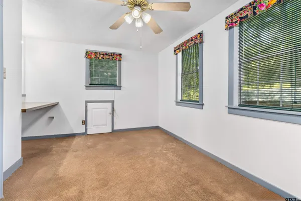 an empty room with windows