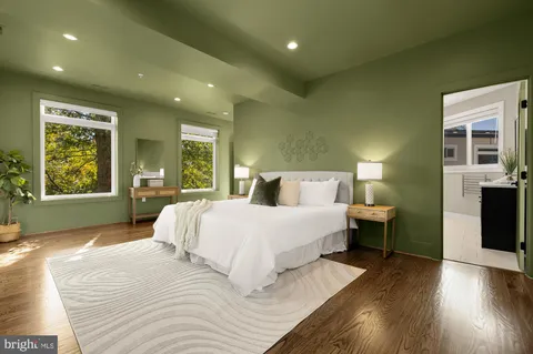 a spacious bedroom with a large bed and a window