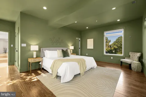 a spacious bedroom with a large bed and a couch