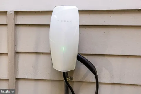a view of staircase with wooden floor and cabinet