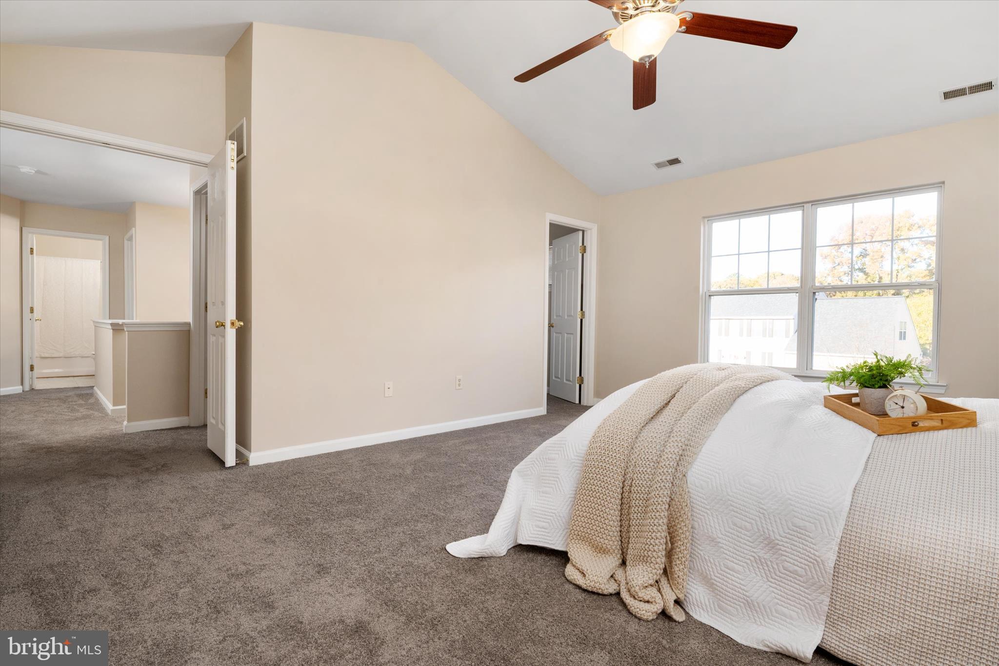 1409 Sweet Cherry Court Severn, MD 21144 - Photo 24 of 56 a bedroom with a bed and a large window