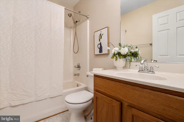 a view of storage and utility room with washer and dryer