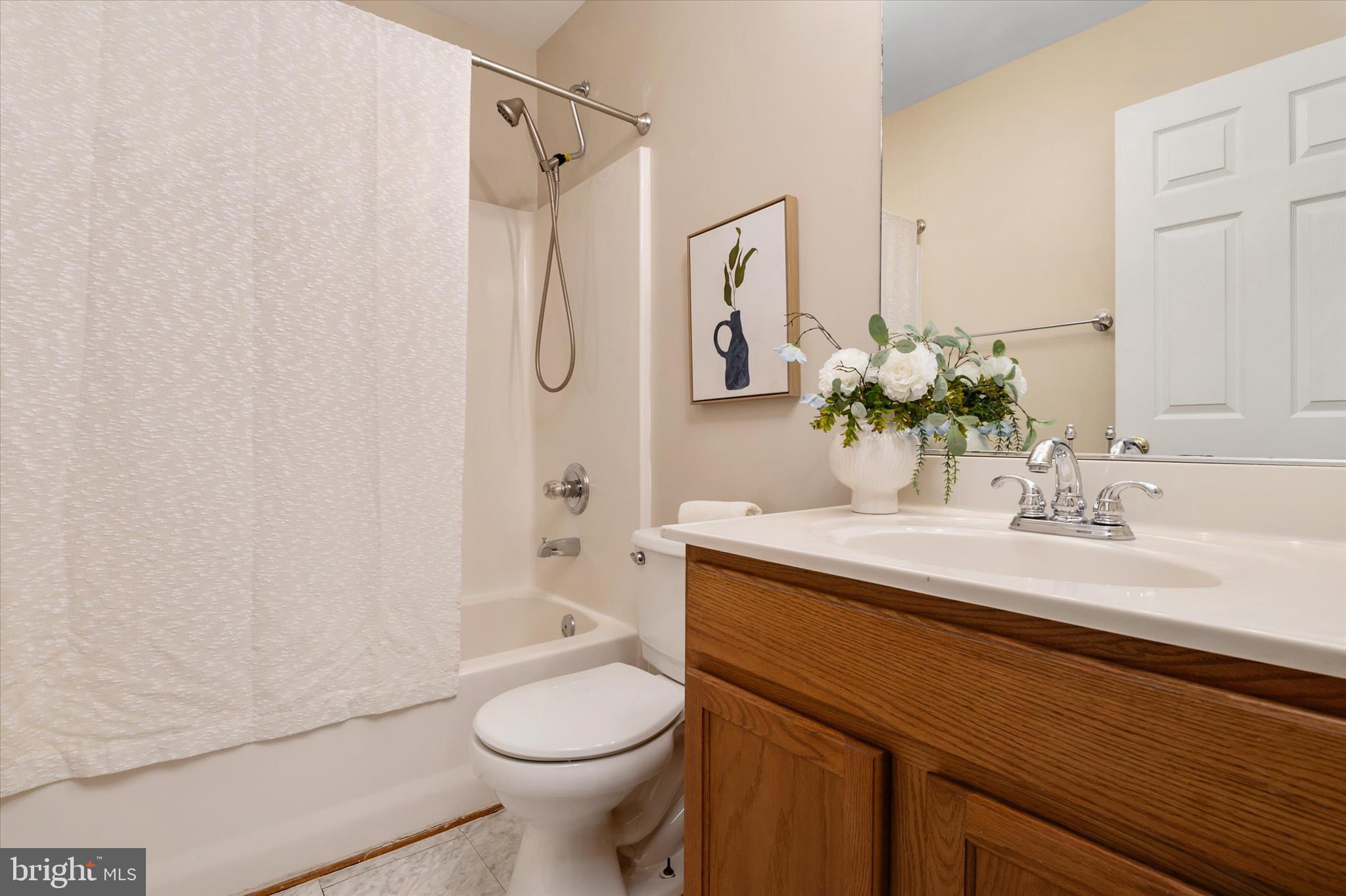 1409 Sweet Cherry Court Severn, MD 21144 - Photo 34 of 56 a bathroom with a sink a toilet and shower