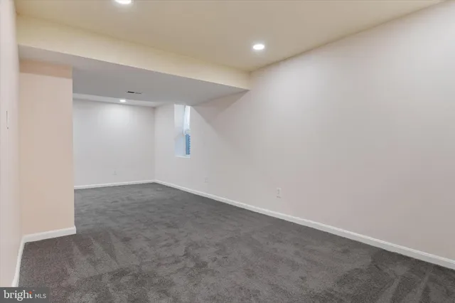 a bathroom with a sink and mirror with toilet