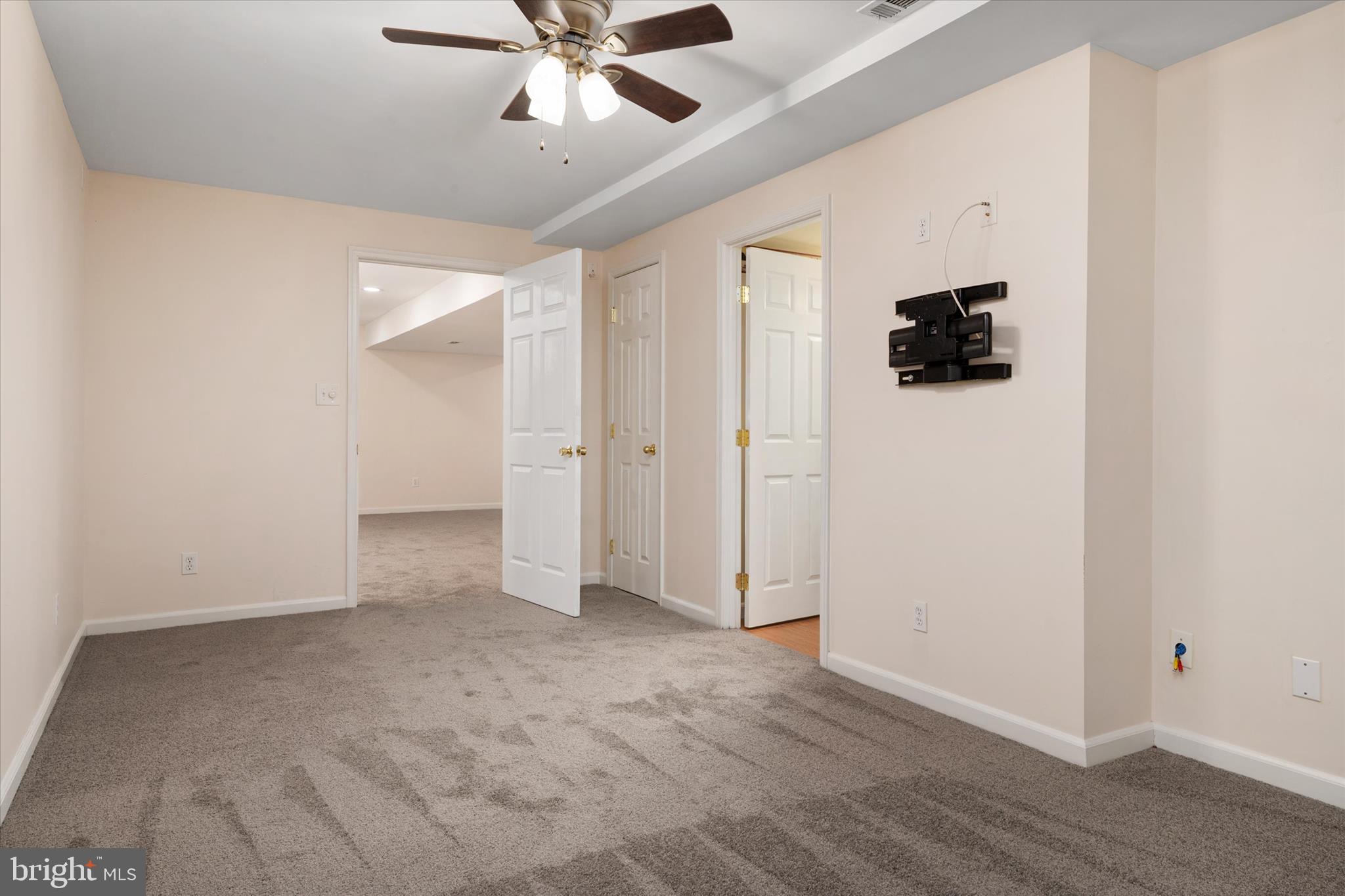 1409 Sweet Cherry Court Severn, MD 21144 - Photo 43 of 56 an empty room with wooden floor and windows