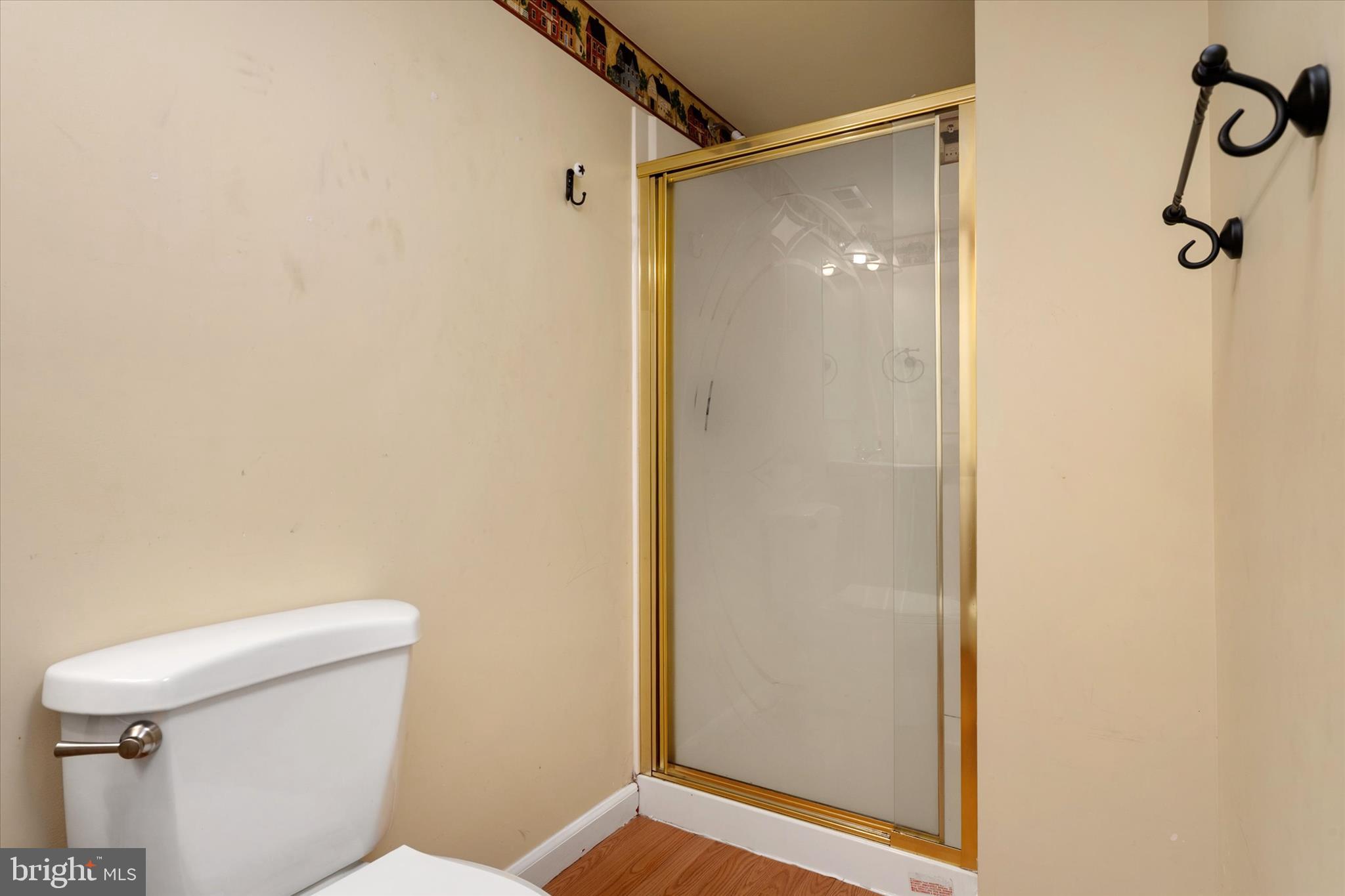 1409 Sweet Cherry Court Severn, MD 21144 - Photo 45 of 56 a bathroom with a toilet and shower