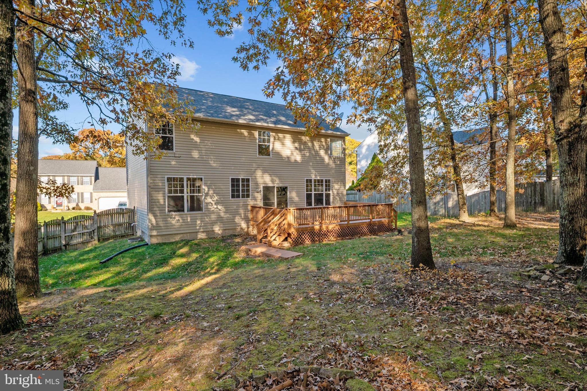 1409 Sweet Cherry Court Severn, MD 21144 - Photo 49 of 56 a view of a house with backyard and trees