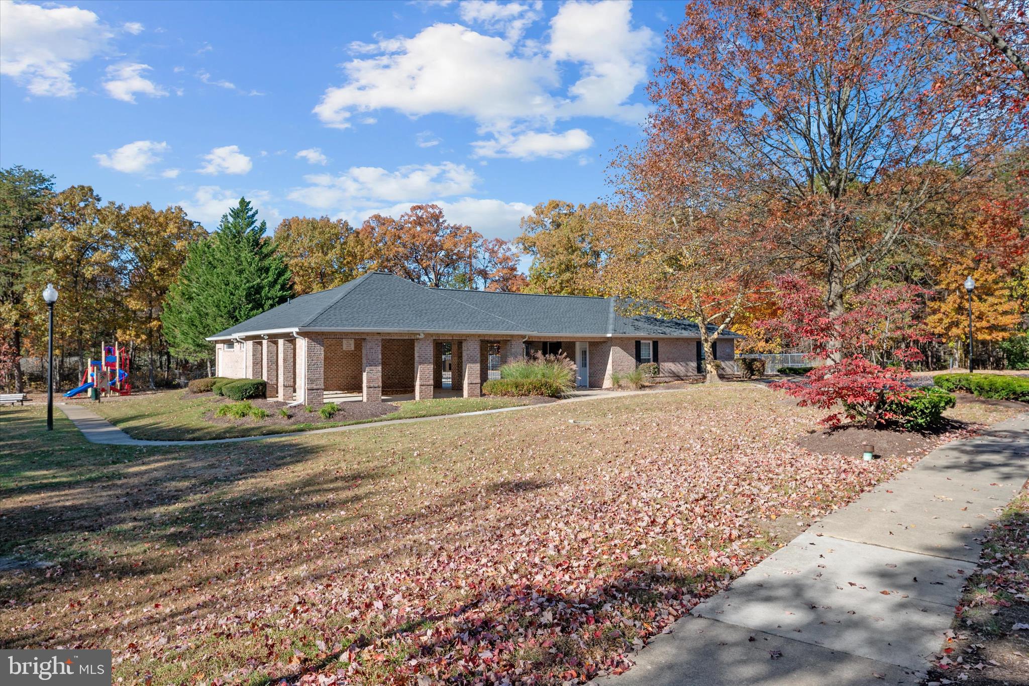 1409 Sweet Cherry Court Severn, MD 21144 - Photo 53 of 56 a front view of a house with a garden