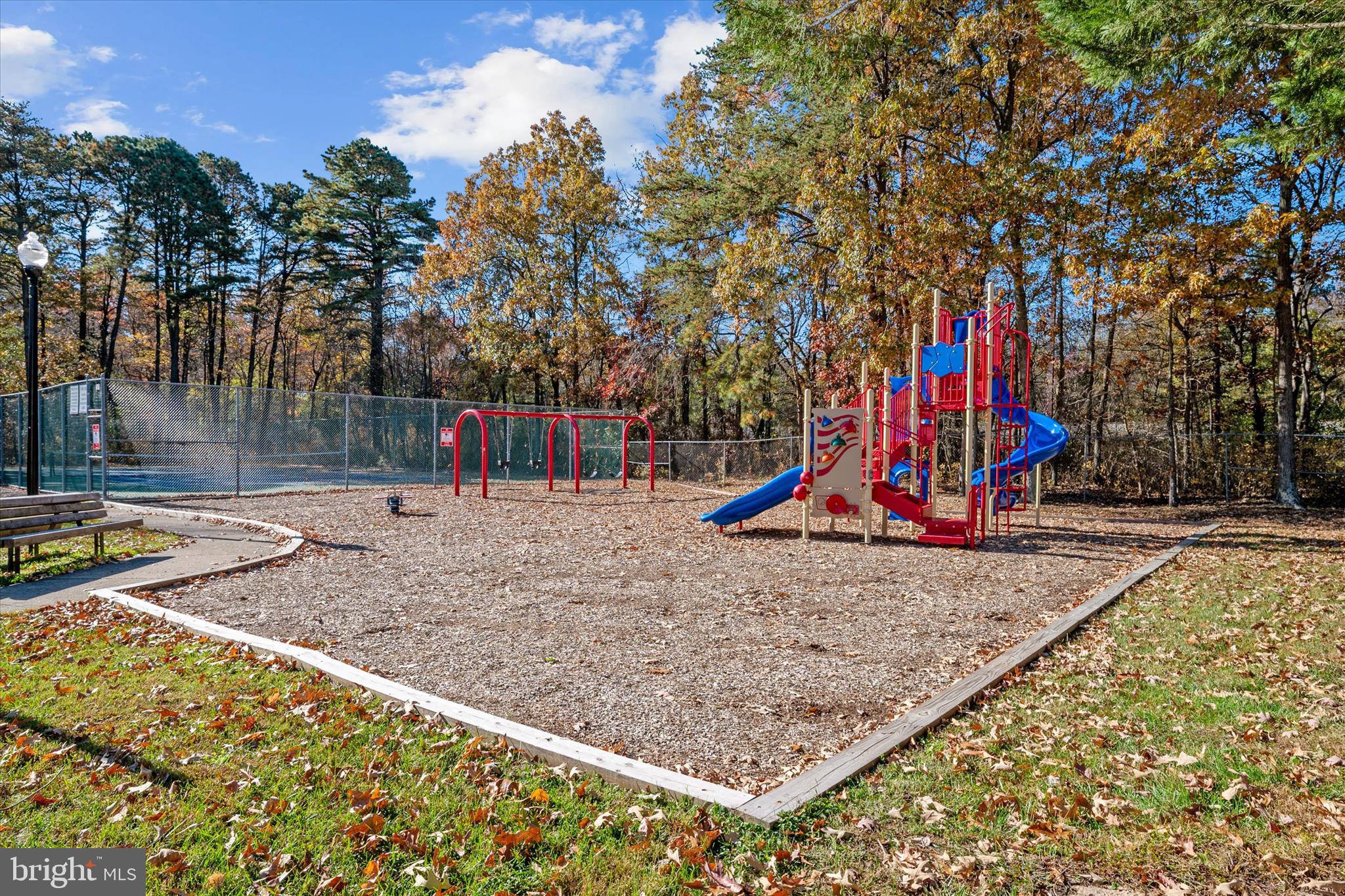 1409 Sweet Cherry Court Severn, MD 21144 - Photo 55 of 56 a view of a park with swings