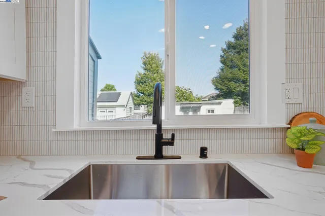 a kitchen with a sink and a window