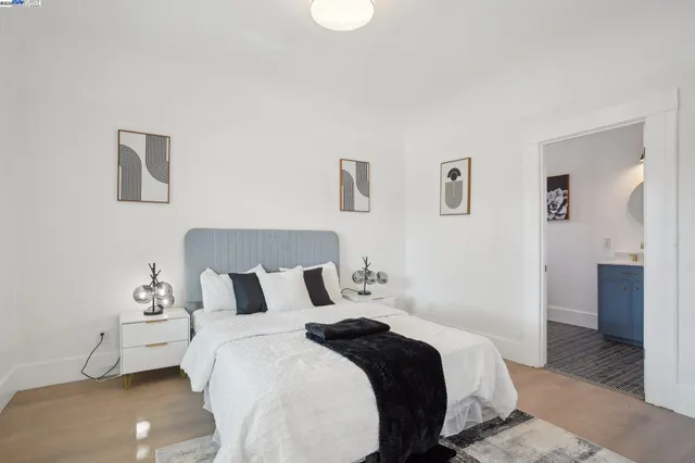 a bedroom with a bed and a couch