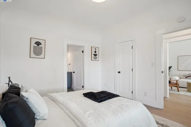 a bedroom with a bed and a view of bedroom