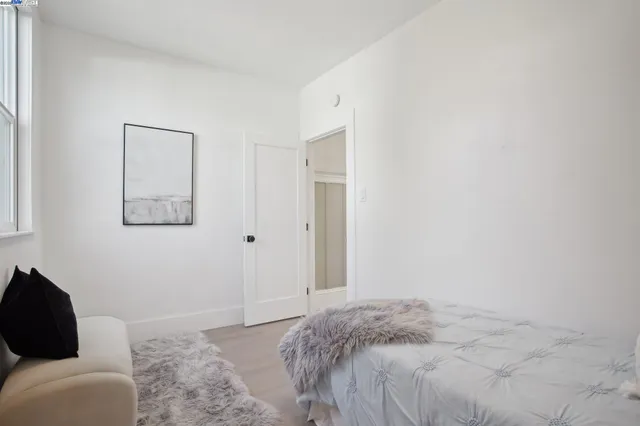 a bedroom with a bed and couch