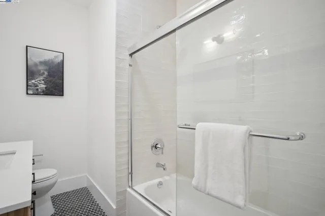 a bathroom with a shower and a toilet